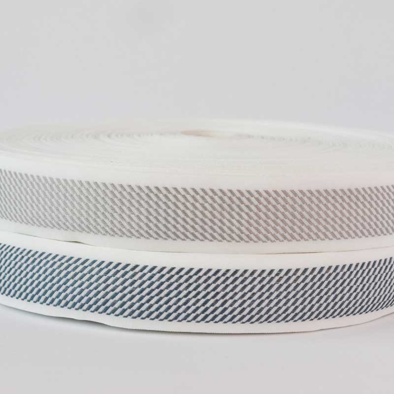 Cinta  terminado de colchón 4 cm/ Base blanca/rollo x 100 metros