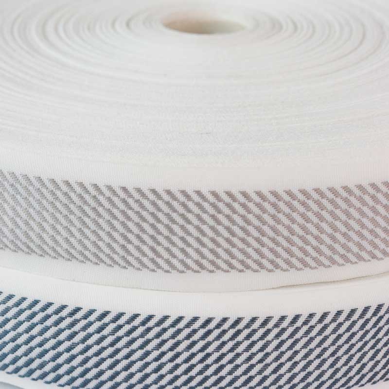 Cinta  terminado de colchón 4 cm/ Base blanca/rollo x 100 metros