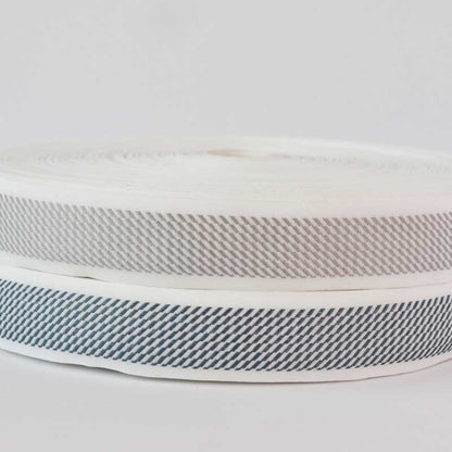 Cinta  terminado de colchón 4 cm/ Base blanca/rollo x 100 metros